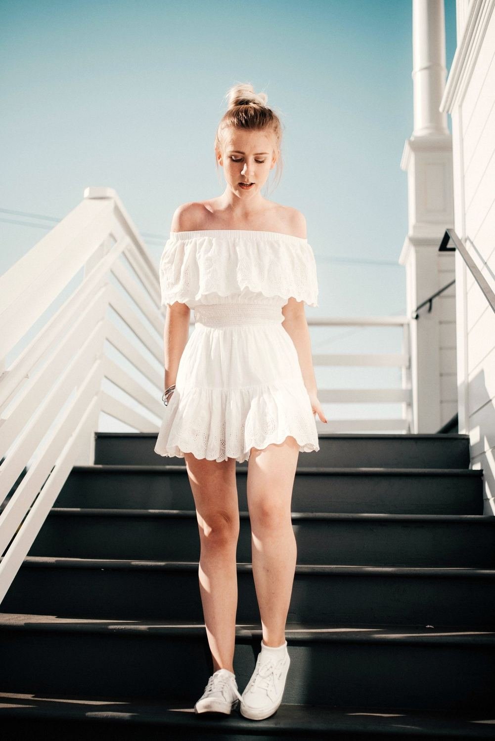 White off-shoulder dress in the sun