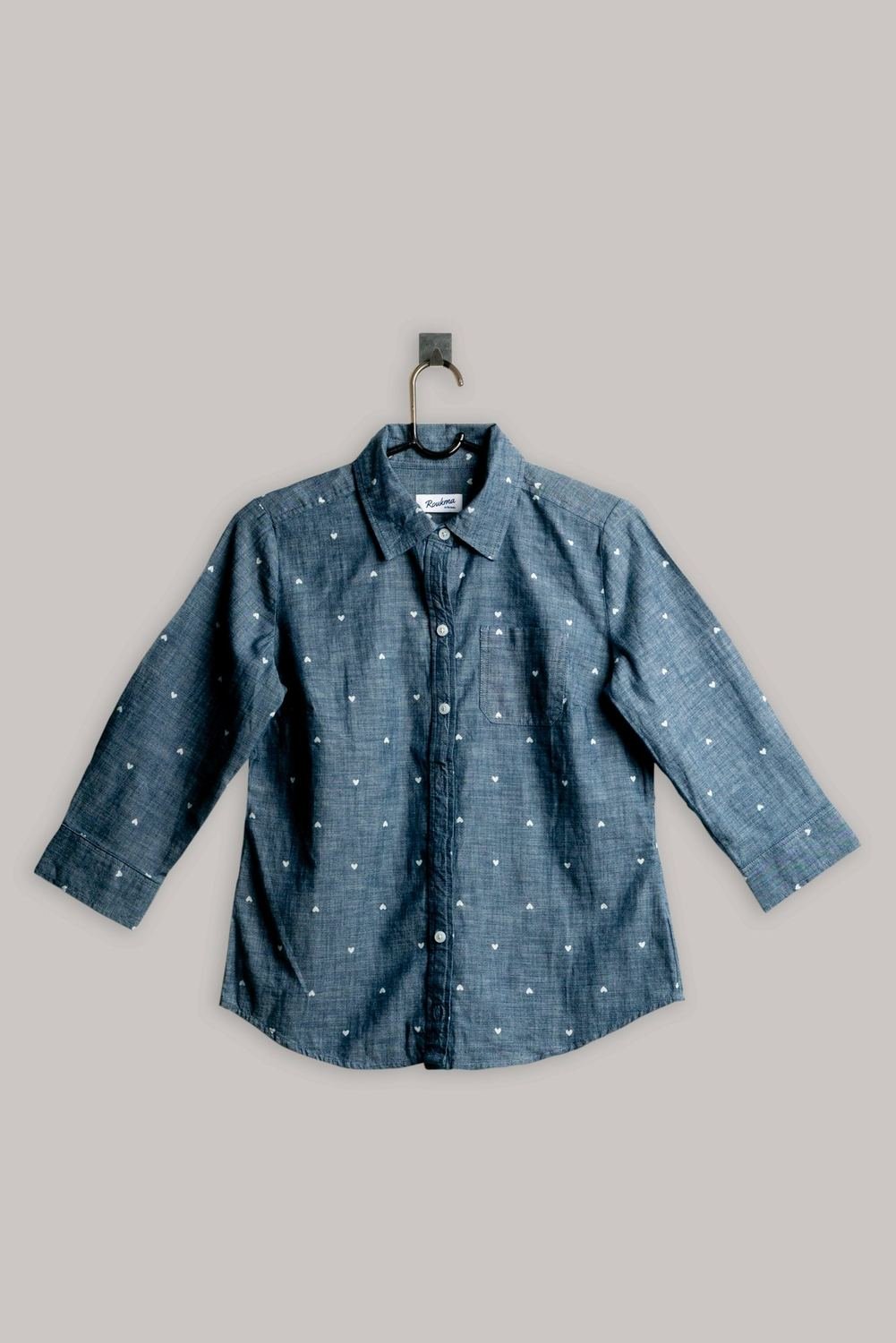 Faded chambray shirt on a hanger